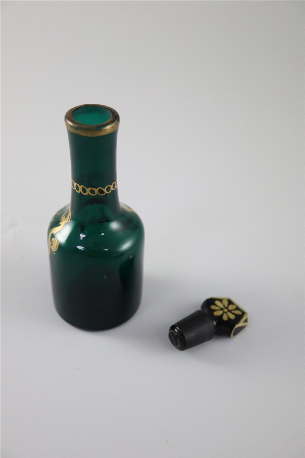 A George III green glass ketchup cruet bottle and stopper, gilded in the James Giles atelier, c.1770, 11.5cm high